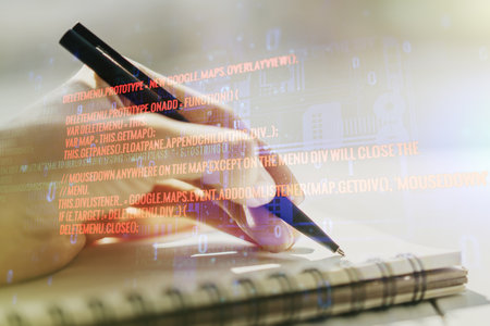 Abstract creative coding concept with man hand writing in notebook on background. Multiexposureの写真素材