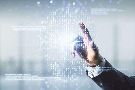 Man hand working with abstract virtual code skull illustration on blurred office background. Hacking and phishing concept. Multiexposureの写真素材
