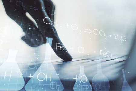 Creative chemistry concept with hands typing on laptop on background. Multiexposureの写真素材