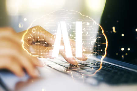 Creative artificial Intelligence concept with human brain hologram and hands typing on laptop on background. Multiexposureの写真素材