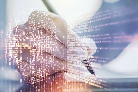 Creative code skull hologram and woman hand writing in diary on background, cybercrime and hacking concept. Multiexposureの写真素材