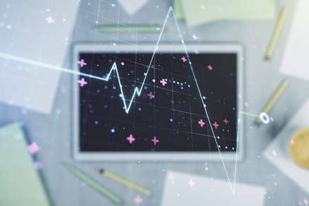 Double exposure of creative abstract heart rate hologram and digital tablet on background, top view. Healthcare technolody conceptの写真素材