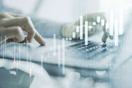 Multi exposure of abstract creative financial chart with hand typing on computer keyboard on background, research and analytics conceptの写真素材