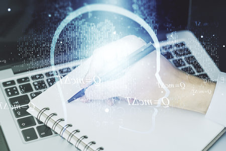 Creative artificial Intelligence concept with human head hologram and hand writing in notebook on background with laptop. Multiexposureの写真素材