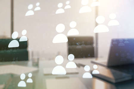 Double exposure of social network icons concept and modern desktop with laptop on background. Marketing and promotion conceptの写真素材