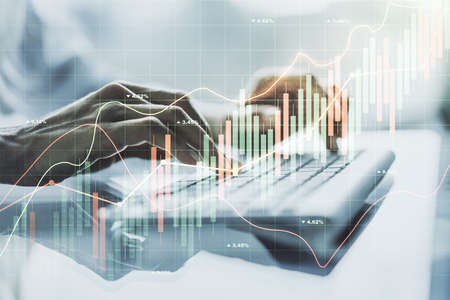 Multi exposure of abstract financial diagram with hand typing on computer keyboard on background, banking and accounting conceptの写真素材