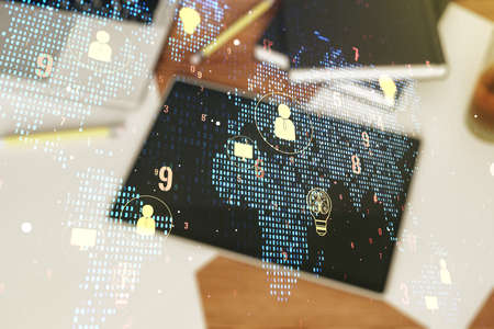 Double exposure of social network icons concept with world map and modern digital tablet on background. Networking conceptの写真素材