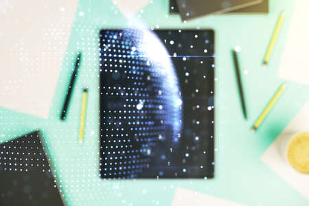 Multi exposure of abstract creative digital world map and digital tablet on background, top view, research and analytics conceptの写真素材