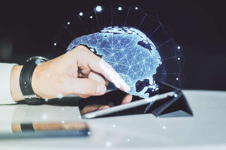 Digital America map and finger clicks on a digital tablet on background, international trading concept. Multiexposureの写真素材