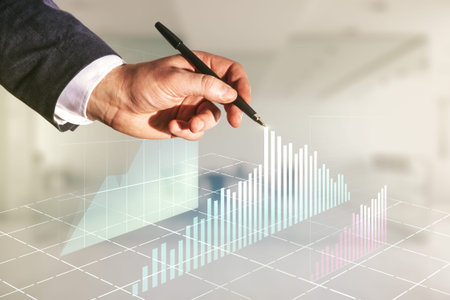 Double exposure of man hand with pen working with abstract creative financial chart hologram on...