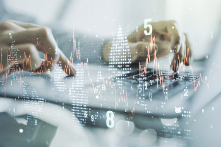 Multi exposure of abstract creative financial graph with hand typing on laptop on background, forex...