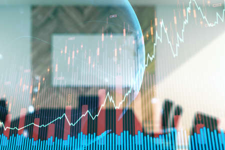 Abstract creative financial graph interface and world map on a modern conference room background, forex and investment concept. Multiexposureの写真素材