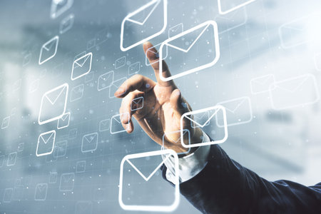 Man hand clicks on abstract virtual postal envelopes hologram on blurred office background, email...