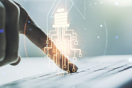 Creative light bulb with chip hologram and hands typing on computer keyboard on background,...