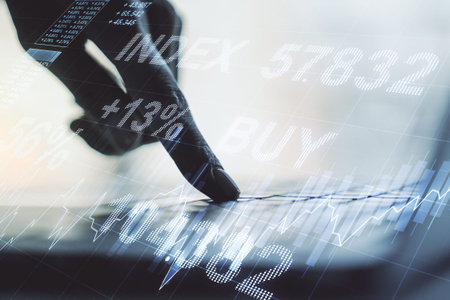 Double exposure of abstract creative financial diagram with hand typing on computer keyboard on...