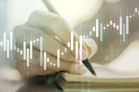 Multi exposure of abstract financial diagram with hand writing in notepad on background, banking and...