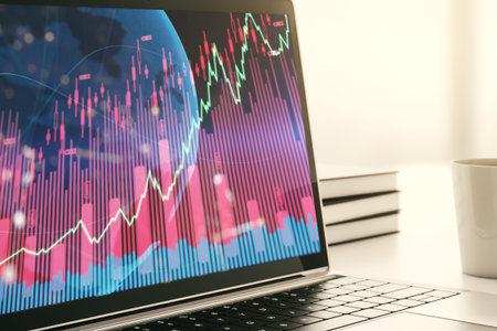 Computer monitor with abstract creative financial graph with world map, financial and trading...