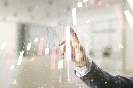 Multi exposure of analyst hand clicks on virtual abstract financial graph and world map on blurred office background, financial and trading conceptの写真素材