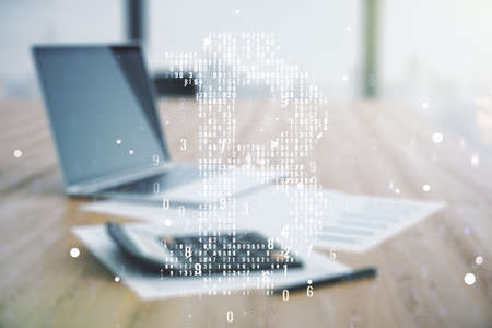 Virtual Bitcoin hologram on calculator and laptop background. Multiexposureの写真素材