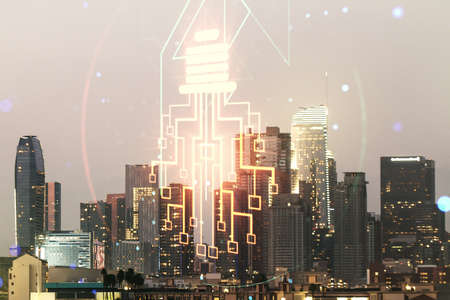 Virtual creative light bulb with chip hologram on Los Angeles office buildings background, artificial Intelligence and neural networks concept. Multiexposureの写真素材