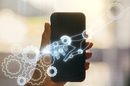 Double exposure of robotics technology hologram and hand with cell phone on background. Research and...