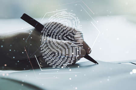 Abstract creative fingerprint concept with man hand writing in notebook on background. Multi exposureの写真素材