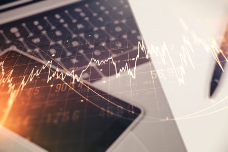 Abstract creative financial graph on modern laptop background, financial and trading concept.