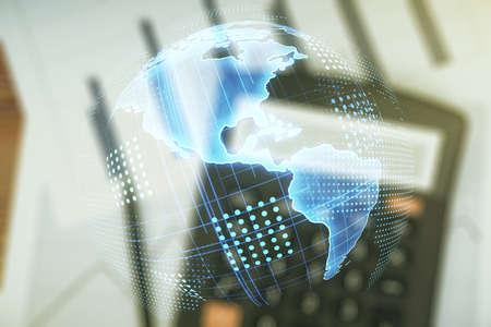 Virtual digital map of North America on calculator background, international trading concept. Multiexposureの写真素材