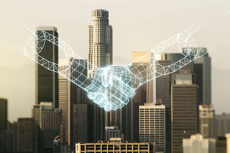 Abstract virtual blockchain technology hologram with handshake on Los Angeles skyline background. Digital money transfers and decentralization concept. Multiexposureの写真素材