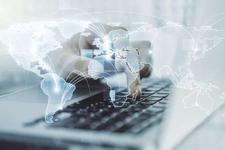 Abstract graphic digital world map with connections and hands typing on computer keyboard on background, globalization concept. Multiexposureの写真素材