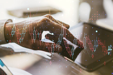 Multi exposure of abstract creative financial chart with finger presses on a digital tablet on...