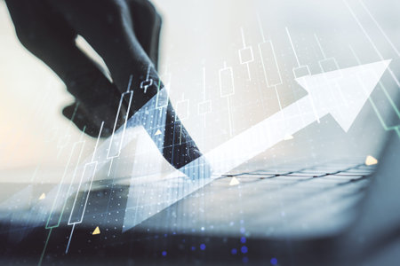 Double exposure of abstract creative financial diagram with upward arrow and hands typing on...