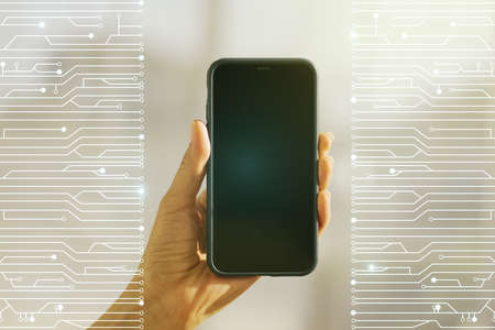 Creative abstract micro circuit sketch and hand with cellphone on background, future technology and AI concept. Double exposureの写真素材