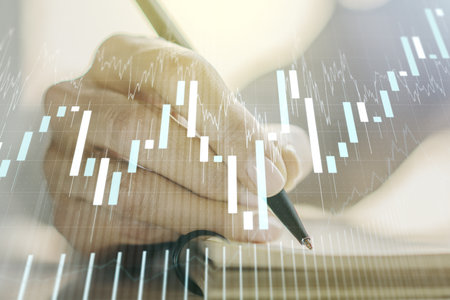 Double exposure of abstract creative financial chart with hand writing in notebook on background, research and strategy conceptの写真素材