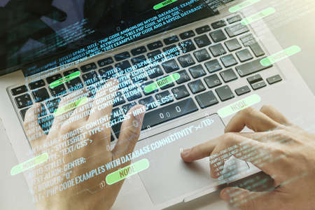 Abstract creative coding illustration with hands typing on laptop on background, software development concept. Multi exposureの写真素材