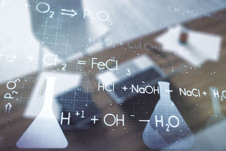 Double exposure of creative chemistry concept and modern desktop with laptop on background, research and development conceptの写真素材