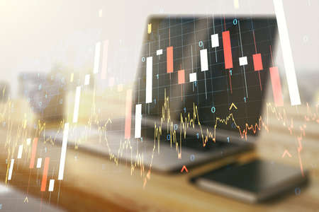 Multi exposure of abstract creative financial graph with world map and modern desktop with computer on background, forex and investment conceptの写真素材