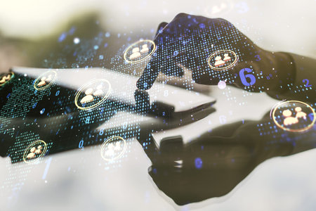 Double exposure of social network icons concept with world map and hand working with a digital...