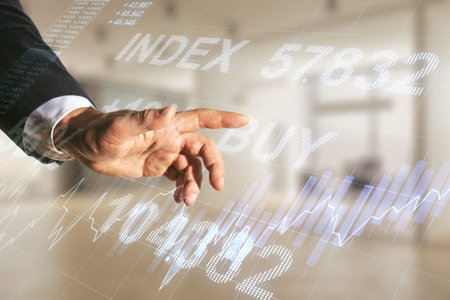 Multi exposure of trader hand clicks on virtual abstract financial graph interface on blurred office background, financial and trading conceptの写真素材
