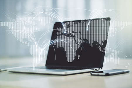 Double exposure of abstract digital world map with connections on laptop background, research and strategy conceptの写真素材