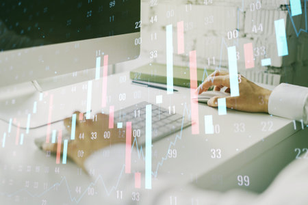 Multi exposure of abstract creative financial chart with hand typing on computer keyboard on...