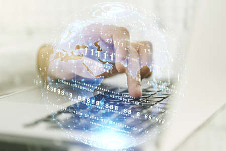 Multi exposure of abstract programming language hologram with world map and hands typing on computer keyboard on background, artificial intelligence and neural networks conceptの写真素材