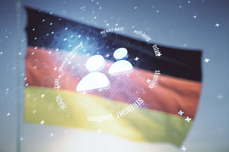 Abstract virtual people icons on flag of Germany and sunset sky background. Life and health insurance concept. Multiexposureの写真素材