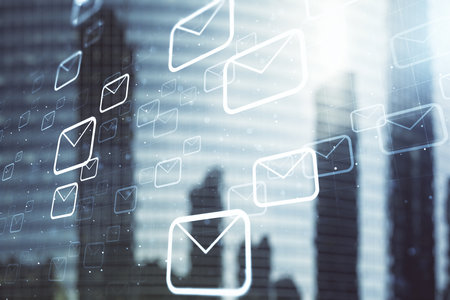 Double exposure of abstract virtual postal envelopes hologram on modern skyscrapers background. Electronic mail and spam conceptの写真素材