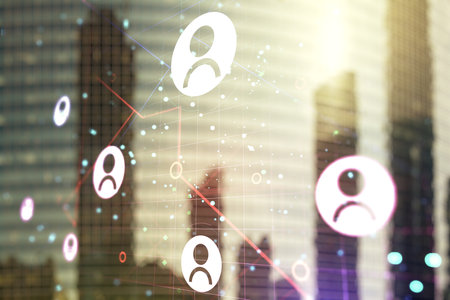 Double exposure of social network icons hologram on blurry cityscape background. Networking conceptの写真素材