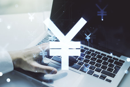 Creative Japanese Yen symbol sketch and hands typing on computer keyboard on background, strategy and forecast concept. Multiexposureの写真素材