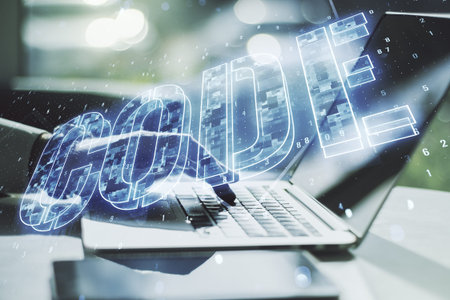 Creative Code word sign and hands typing on laptop on background, international software development...