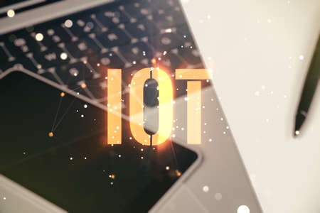 Double exposure of creative IOT hologram on laptop background, research and development conceptの写真素材