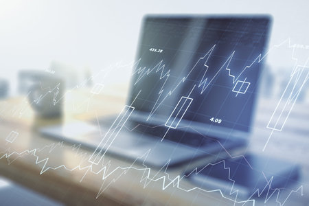 Multi exposure of abstract creative financial graph and modern desktop with computer on background, forex and investment conceptの写真素材