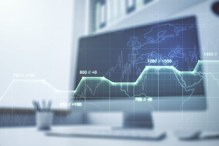 Double exposure of abstract creative statistics data hologram and modern desktop with laptop on...